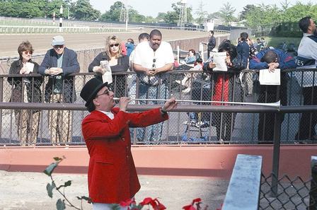 Belmont Park bugler Sam Grossman plays "Call to the Post," heralding the horses as they enter the track before a race. Photo by Dave Mock PD-user