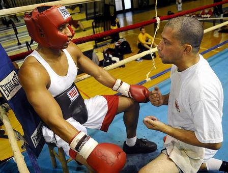 VIRGINIA BEACH, Va. (Oct. 12, 2008) Dave Cruz, right, an assistant coach with 757 Boxing Club in Virginia Beach, Va., gives his fighter pointers between rounds