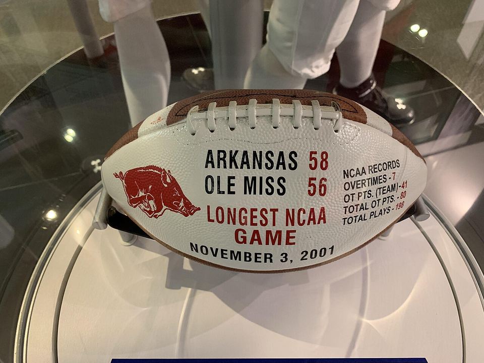 Football commemorating the 2001 Arkansas vs. Ole Miss college football game. The game went to seven overtimes, a record at the time that has since been surpasse