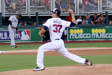 Atlanta Braves pitcher Matt Wisler throws the first pitch of the game against the Miami Marlins at Fort Bragg Field, Fort Bragg, N.C. on Sunday, July 3, 2016. F