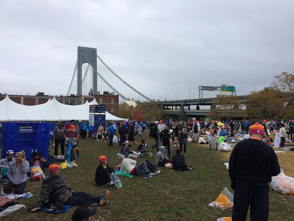 Runners wait at the start village of the New New York City Marathon, 2017